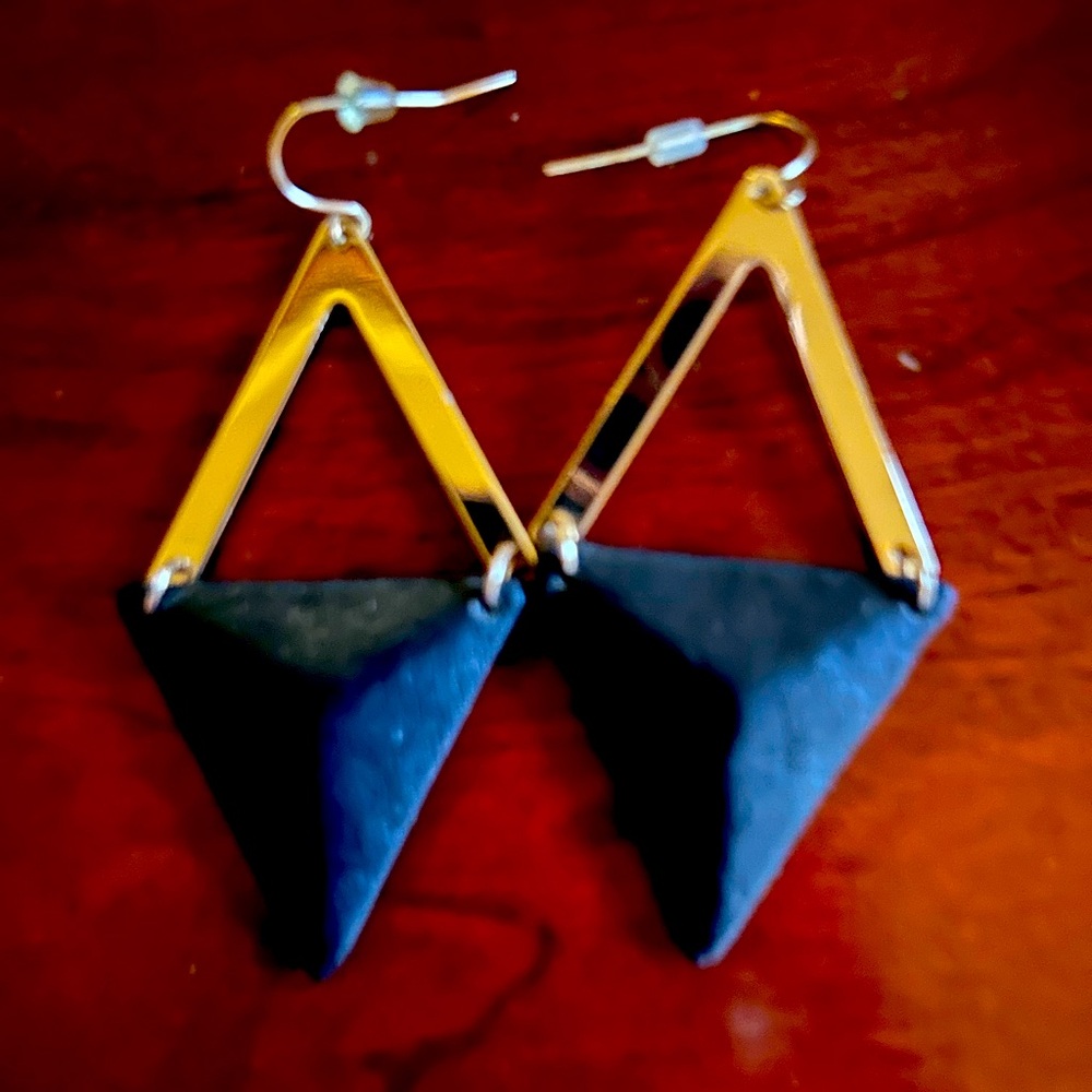Gold earrings with leather accents